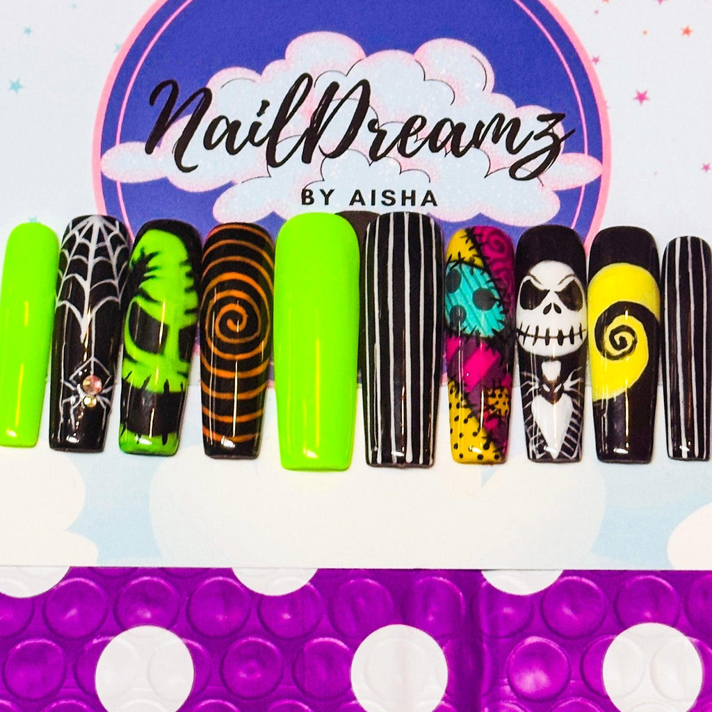 full set layout of Halloween nightmare before Christmas nail designs on display card—oogie boogie, moon phases, slime drips, stitches; neon green/black